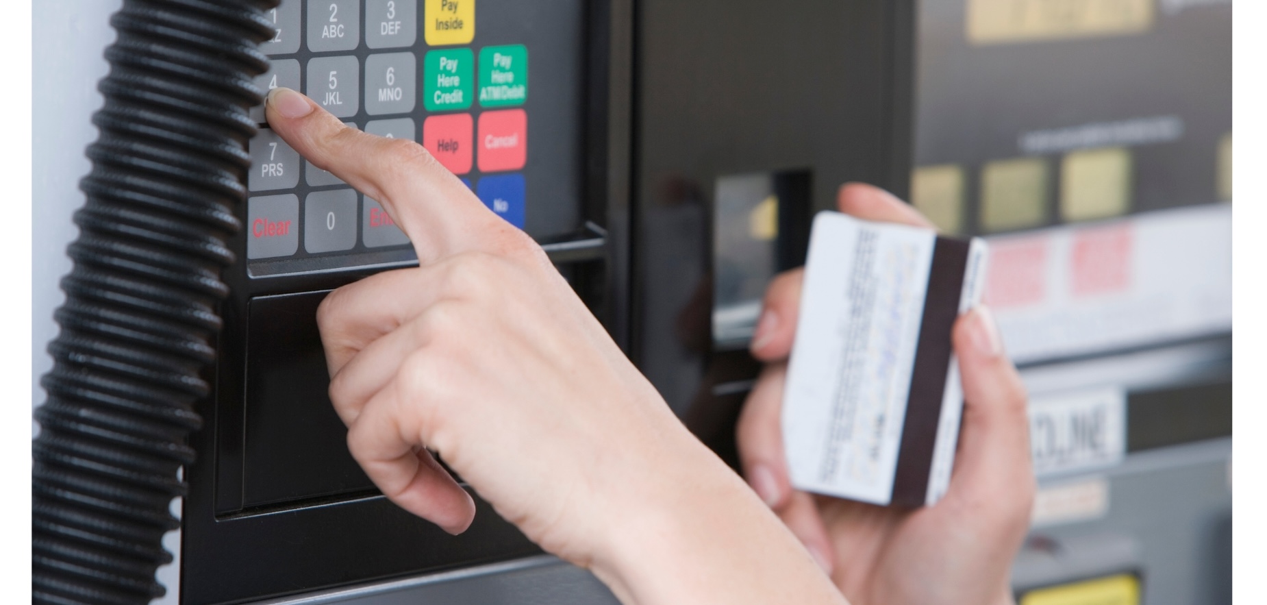Person with a card at a fuel machine