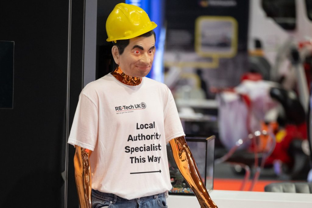 Mr Bean mannequin with hard hat and "Local Authority Specialist This Way" shirt.